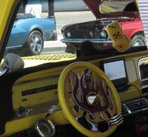 The dashboard, steering wheel, and even the fuzzy dice in the truck are yellow