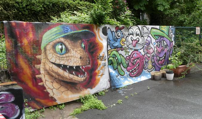 At left, snake wearing green baseball cap. At right, cartoonish figures.
