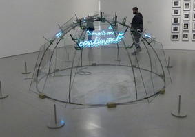 Clear half dome with neon cursive “from continent to continent”