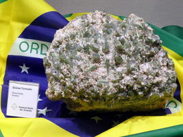 Green tourmaline crystals embedded in a rock