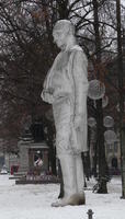Larage sculpture of man made of corrugated cement