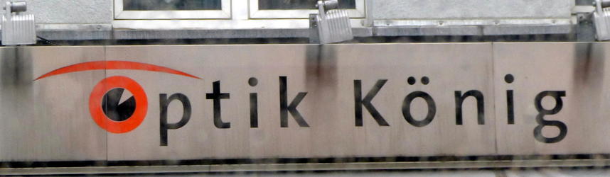 Optic King Logo for Optik König glasses store; first O is in shape of an eye with an eyebrow.