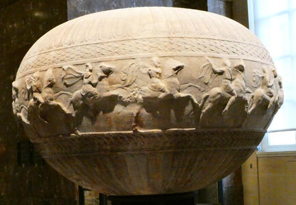 Egg-shaped sculpture with riders on horses
