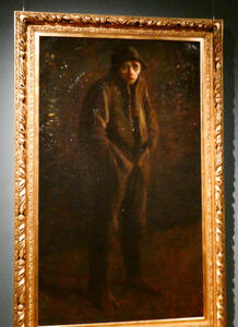 man in coat with hands in pockets