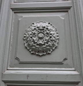 Gray-painted symmetrical flower design