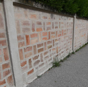 Brick wall with varying shades of orange and brown bricks