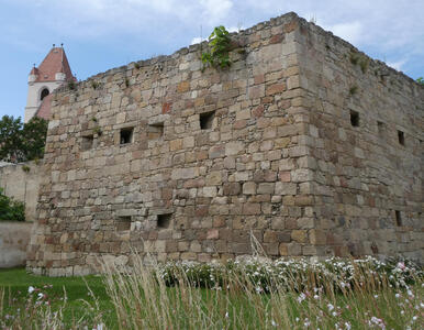Brick buiding that loos like part of a castle fortification