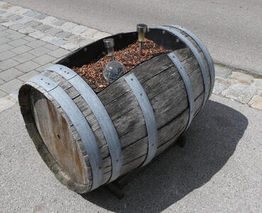 Barrel on its side. It has an opening with planter material and LED lighting (?)