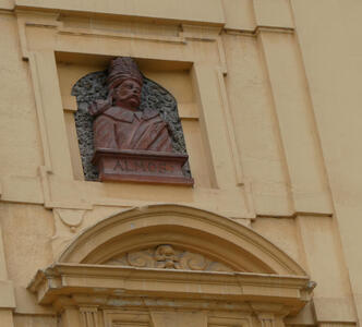 Relief bust of man in turban. Text under bust is ALMOS
