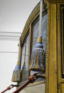 Blue and gold tassels on the carriage