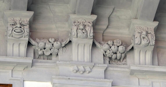 Three faces with tongue sticking out, lip curled upwards, and mouth open as if yawning