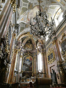 Interior of church with altar and large chandeliers