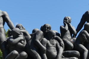 Closeup of figures atop arch