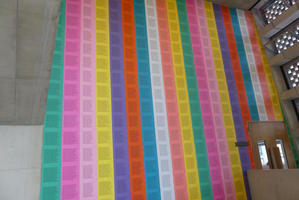 wall of colored paper covered in text wall of colored paper covered in text
