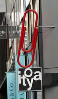store sign in shape of large red paper clip store sign in shape of large red paper clip
