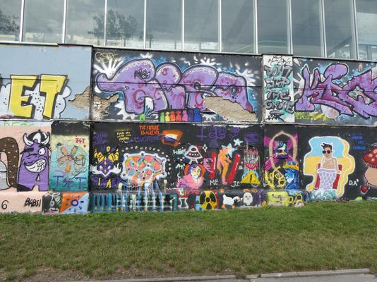 Various graffiti; one of a merman in sunglasses