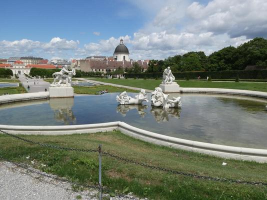 Pool outside castle with statuary in middle
