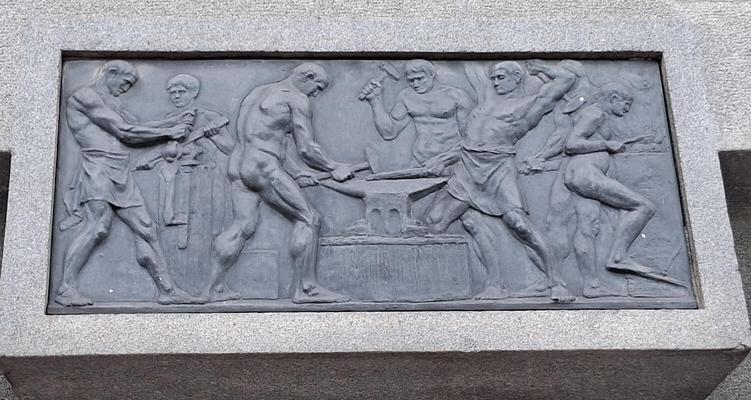 Workers with hammers and anvil
