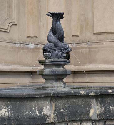 Fountain with two intertwined fish, their tails in the airs, spouting water out their mouths
