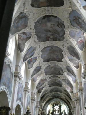 Ceiling with ornate decorations and paintings