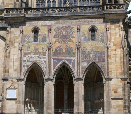 Front of church with religious-themed mosaics.