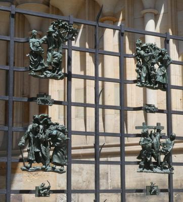 Gate with sculpture of workers