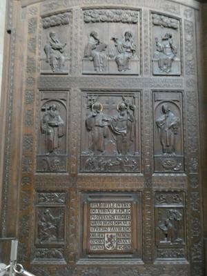 Large wooden area with carvings of various religious figures