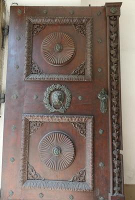 Wooden door with lions-head knocker