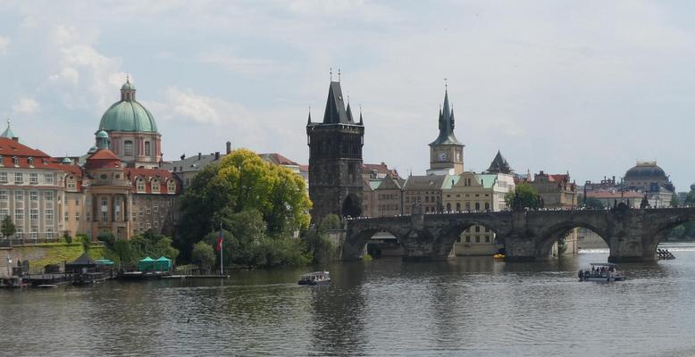 Long view of Charles Bridge. At left, a green-domed building